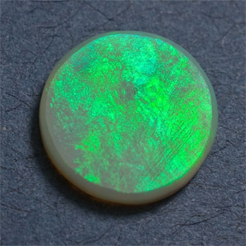 Semi-black Opal 1.22 ct 9.79 dia intense green flash