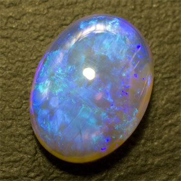Grande opale cristal noire bleu électrique et turquoise 10.15 ct 18.5 x 13.9 mm